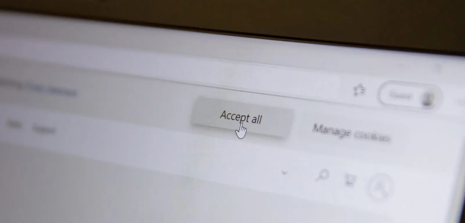 Cookie consent banner with an Accept all button on a computer screen