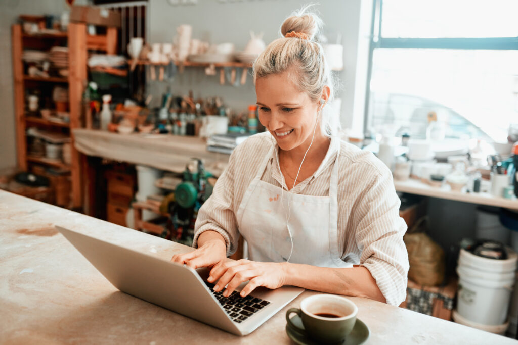 Small business owner optimising her Google Business Profile on a laptop